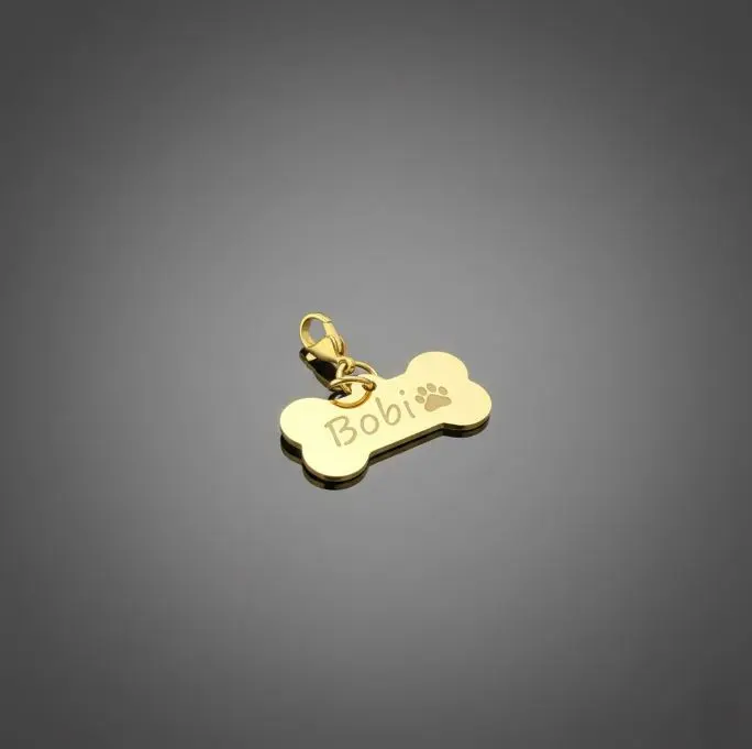 Dije mascota estilo hueso pulido espejo ac. Inox. Dorado mediano 31x16mm