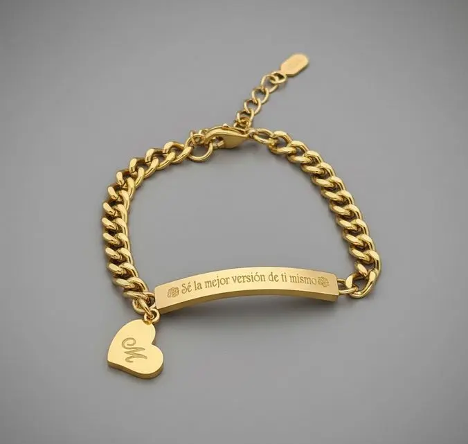 Esclava p/dama placa rectangular -c/dije corazon colgante  ac. Inox. Dorada