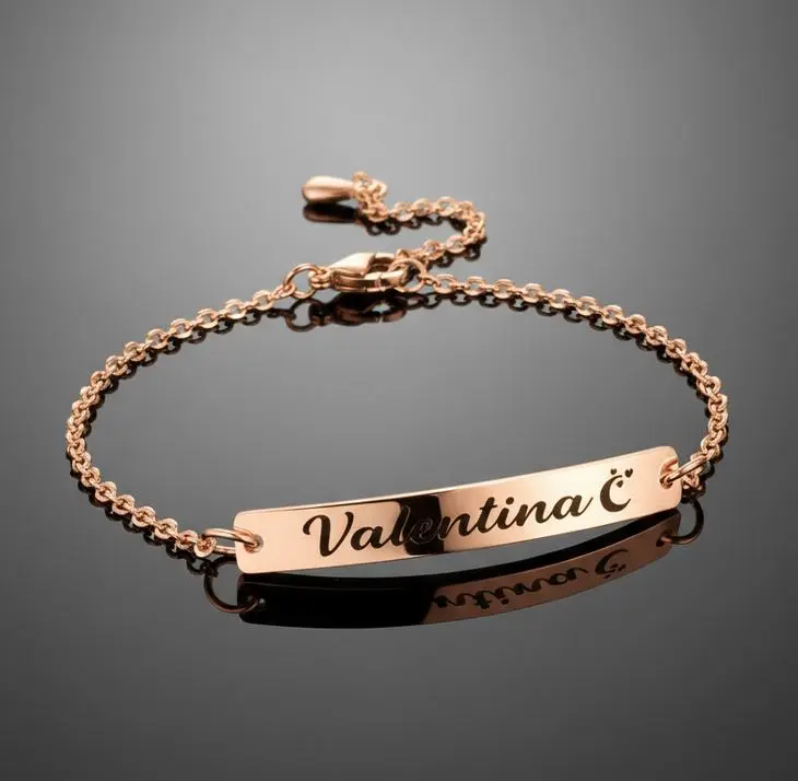 Pulsera dama de aros (estilo rolo) ac. Inox. 2mm c/placa rectangular plateada 5mm con cierre langosta.