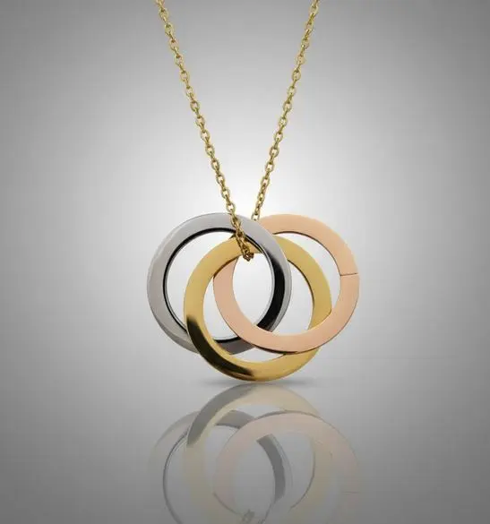 [X-CAAX-036DR] Cadena con Dije aros multicolores entrelazados pulido espejo ac. Inox dorado grande 35mm